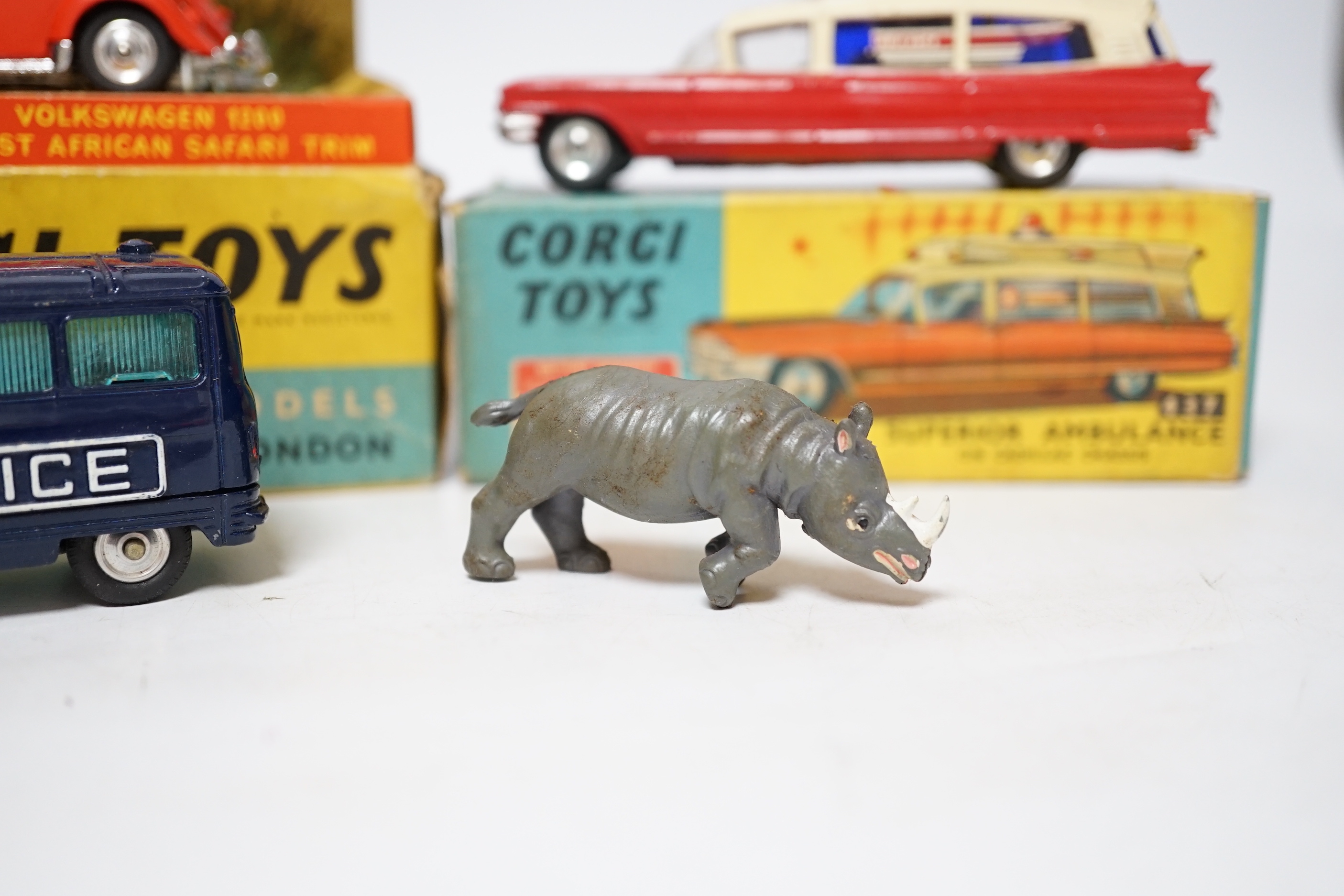 Three Corgi Toys including (256) Volkswagen 1200 in East African safari trim (with rhino and inner display stand), (437) Cadillac Superior Ambulance, both boxed, together with an unboxed Commer three-quarter ton police v